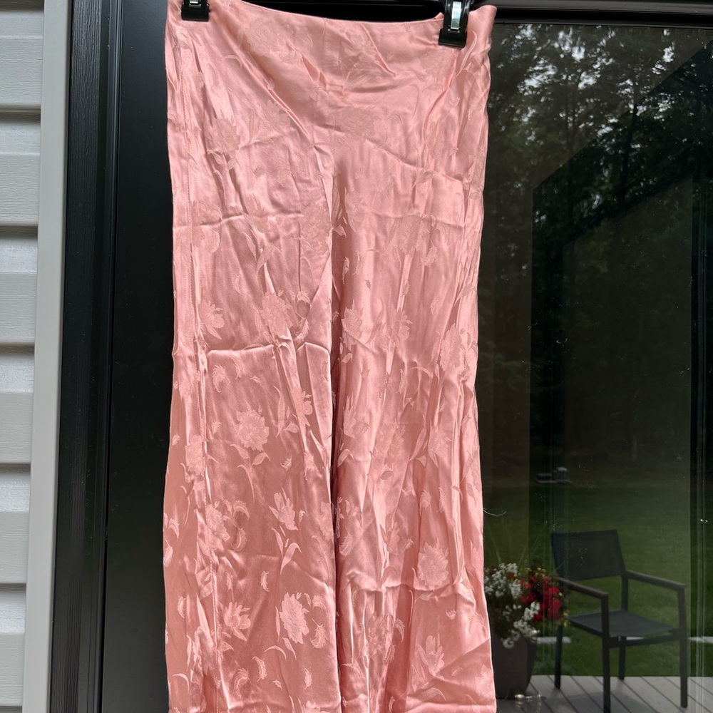 Silly pink skirt, flower details, longer and finished - not shown in the photo